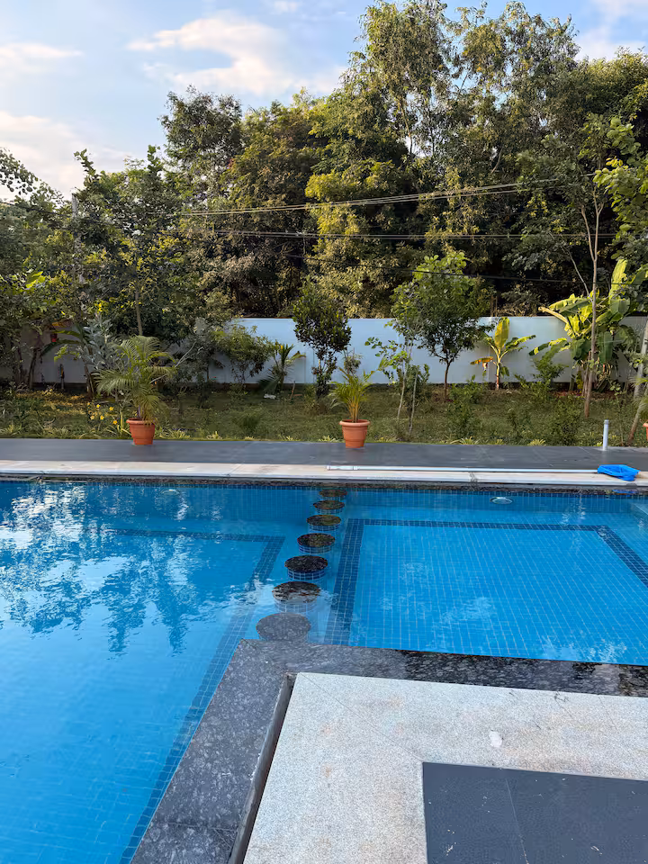 Pool area at dusk with ambient lighting